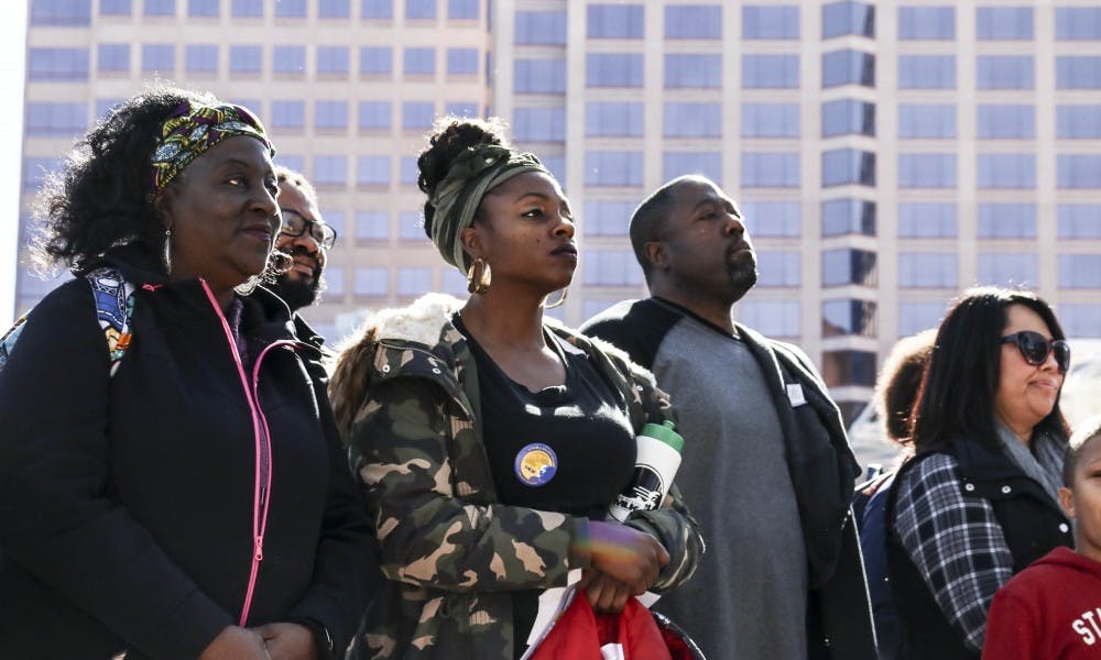 After marching from Dr. MLK Jr. Ave., participants stand strong as speakers address a large audience in Civic Plaza on Jan. 13, 2018.  