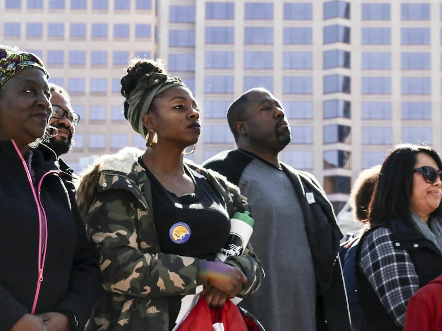 After marching from Dr. MLK Jr. Ave., participants stand strong as speakers address a large audience in Civic Plaza on Jan. 13, 2018.  