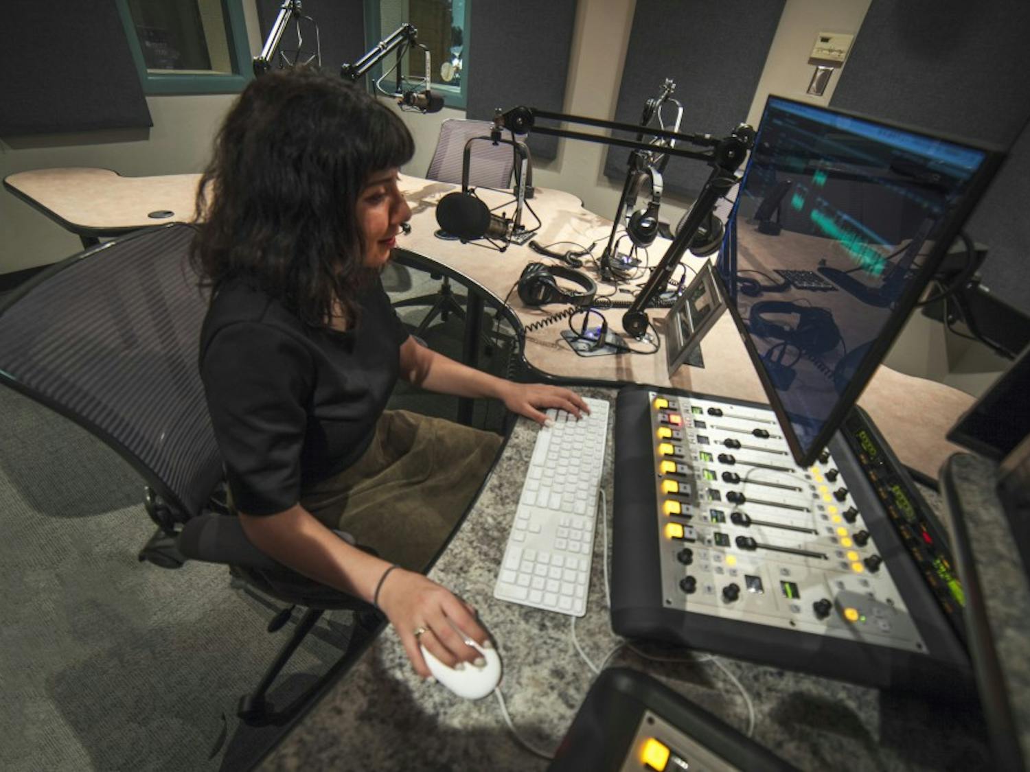 Christina Rodriguez, a Generation Justice fellow &mdash; KUNM's community journalism media project &mdash; edits audio in a KUNM studio. Rodriguez says that public broadcasting is one of the only ways that communities can have agency over their own stories.