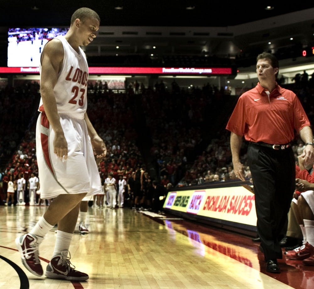 	Phillip McDonald walks off the court after suffering an elbow injury on Saturday at The Pit during the UNM men’s basketball teams 107-62 victory over Manchester College. McDonald will miss the first two regular season games for the Lobos at home against Detroit and Arizona State.