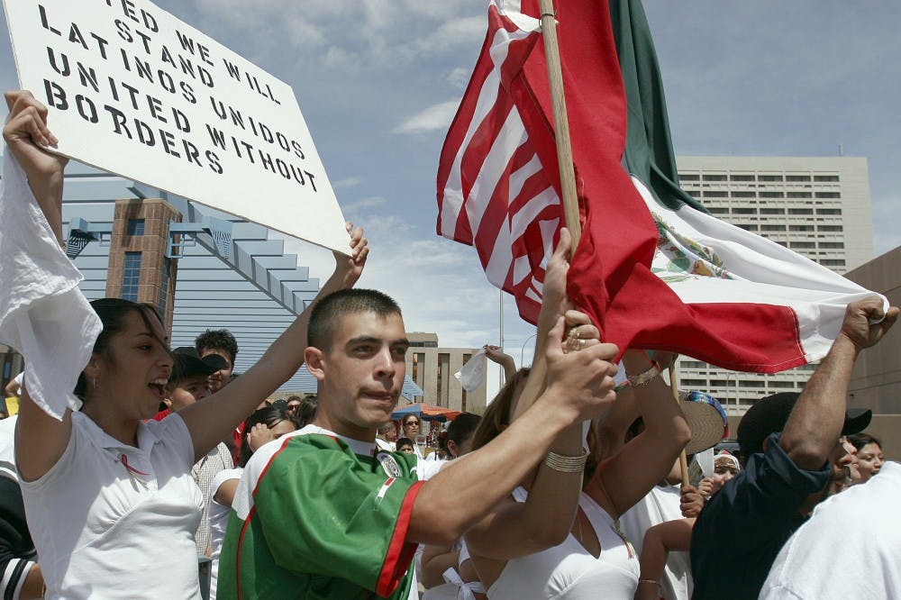 Protesters march at a Downtown immigration rally in April 2006. With an estimated 11.6 million undocumented immigrants living in the United States, immigration reform is a divisive issue in American politics.