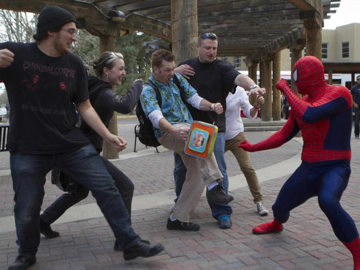 	Spider-Man engages militant mathletes wreaking havoc at UNM Monday afternoon.