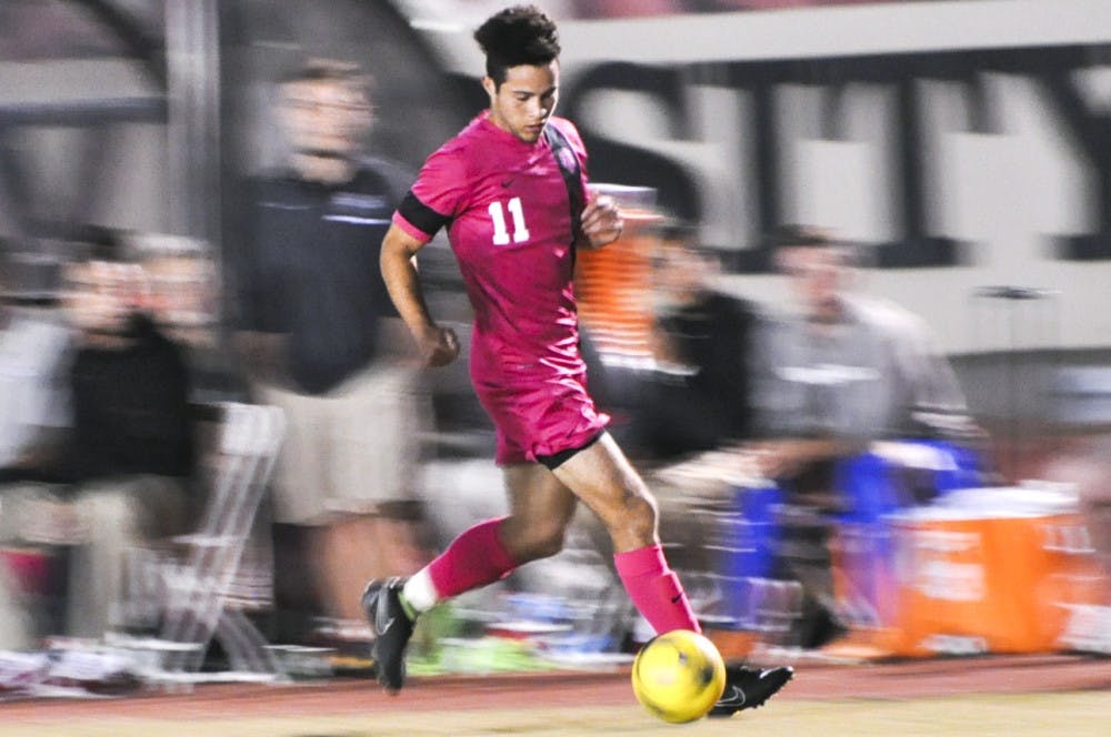 New Mexico midfielder Niko Hansen dribbles the ball downfield against Old Dominion on Saturday night at the Lobo Soccer Complex. The Lobos won 4-0.