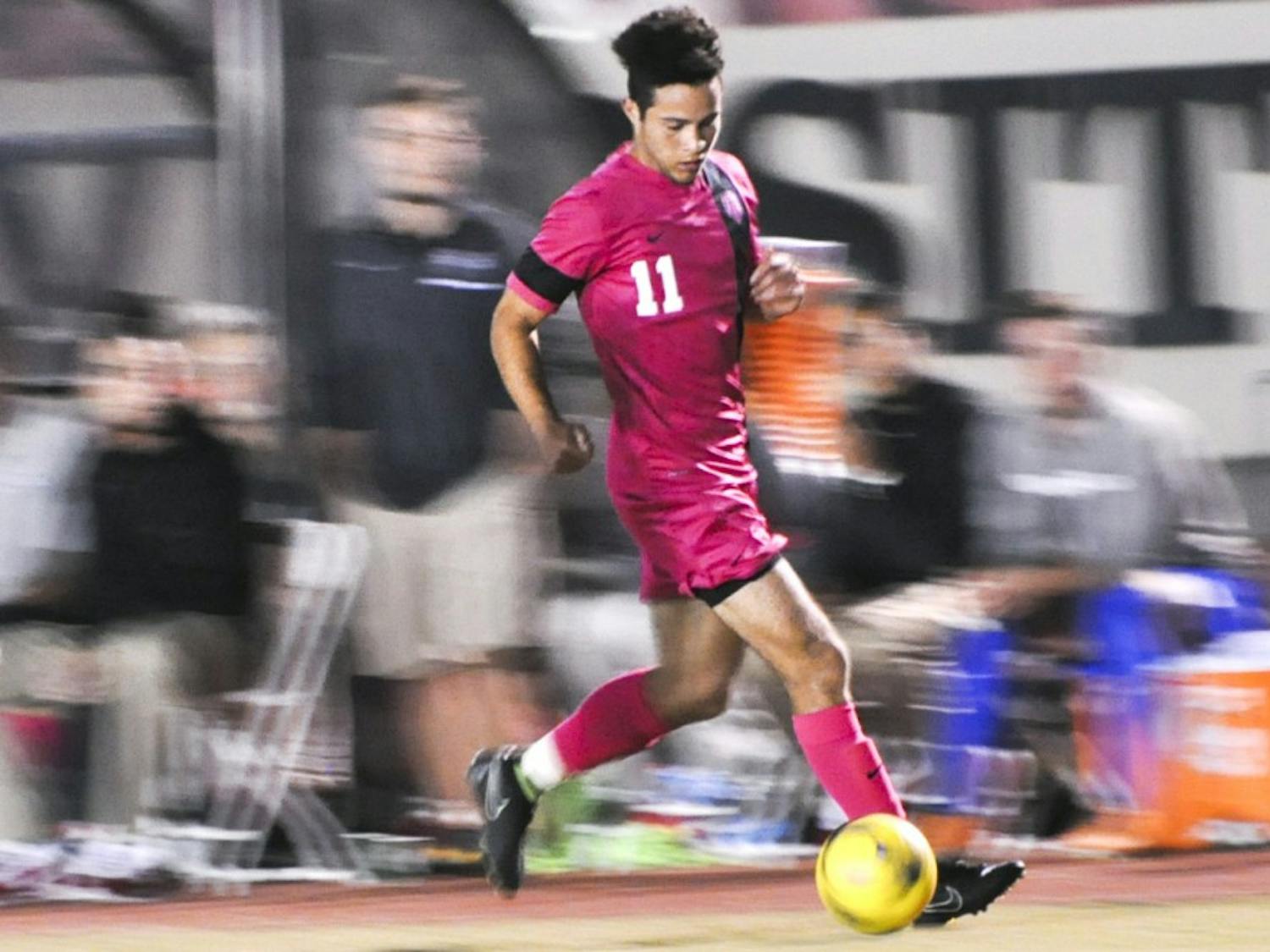 New Mexico midfielder Niko Hansen dribbles the ball downfield against Old Dominion on Saturday night at the Lobo Soccer Complex. The Lobos won 4-0.
