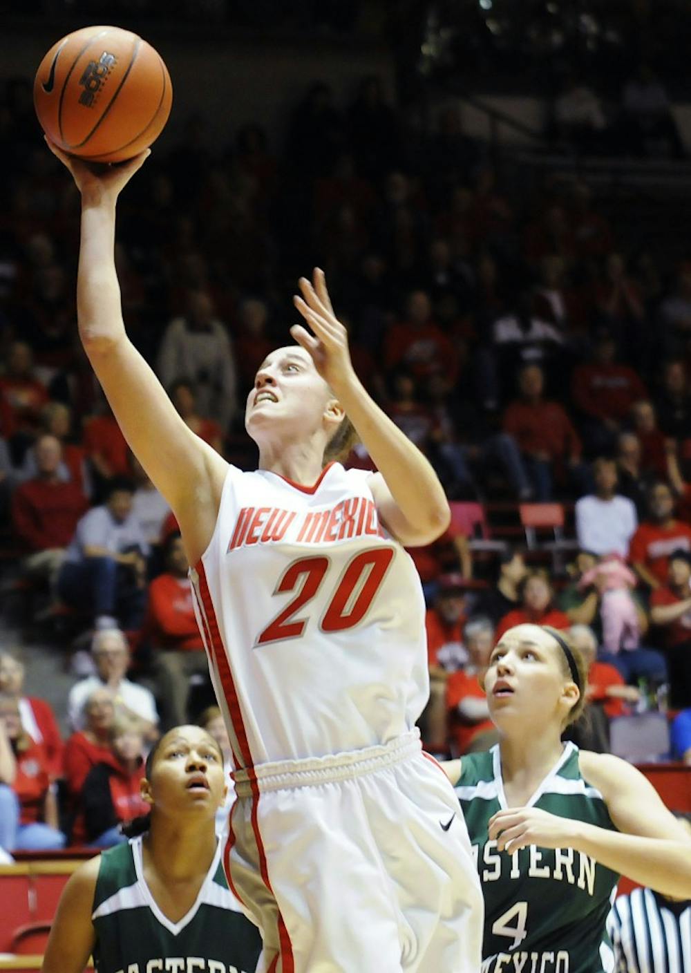 	Lobo guard Sara Halasz shoots a basket during Monday’s exhibition game against Eastern New Mexico at The Pit. The Lobos won 100-52. Check out DailyLobo.com for the story.