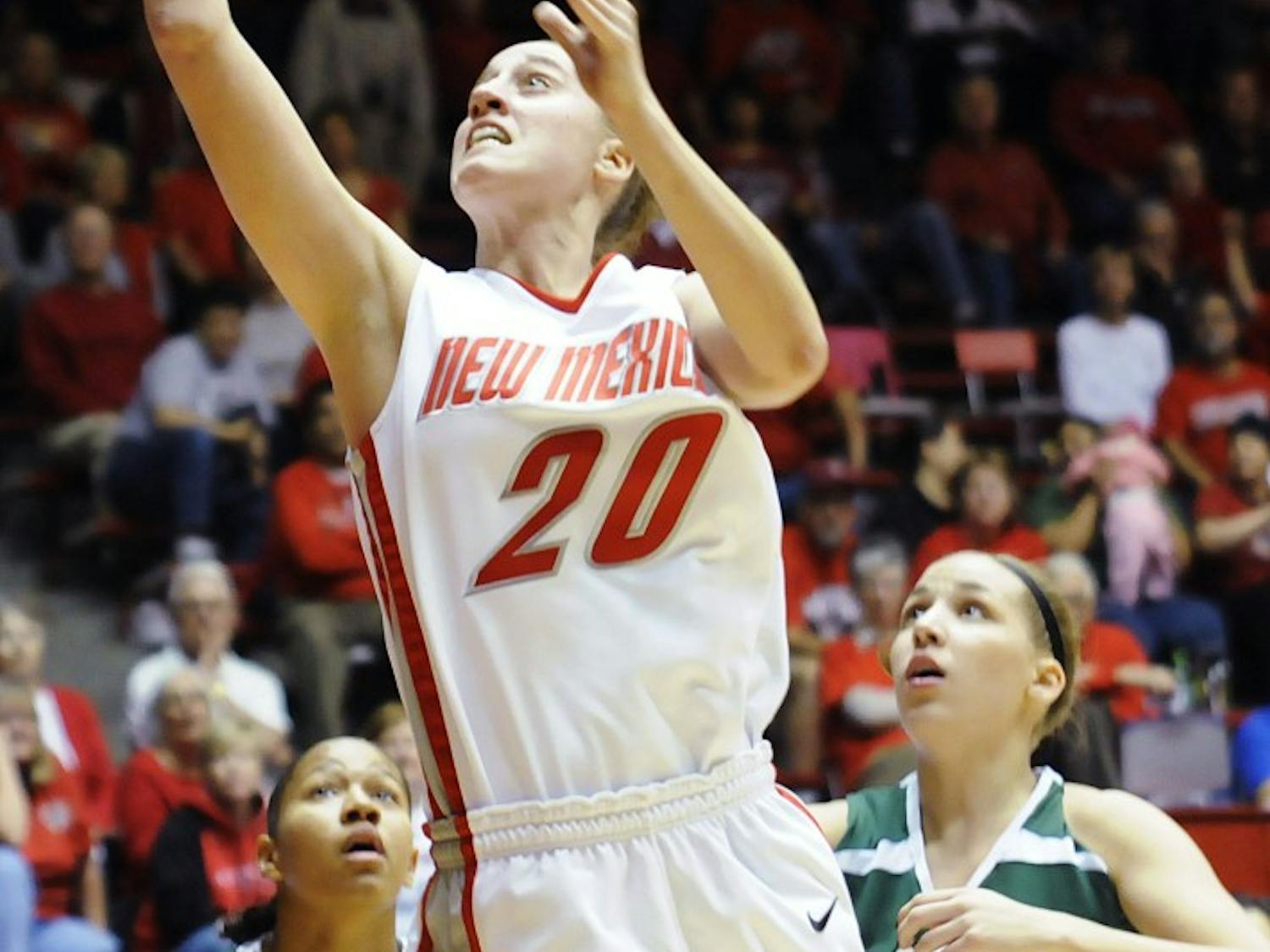 Lobo guard Sara Halasz shoots a basket during Monday’s exhibition game against Eastern New Mexico at The Pit. The Lobos won 100-52. Check out DailyLobo.com for the story.