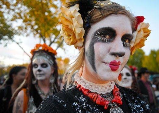 Flo Bargar marches in a Dia de los Muertos parade in the South Valley on Sunday. Dia de los Muertos, or Day of the Dead, is celebrated in memory of loved ones who have died. 