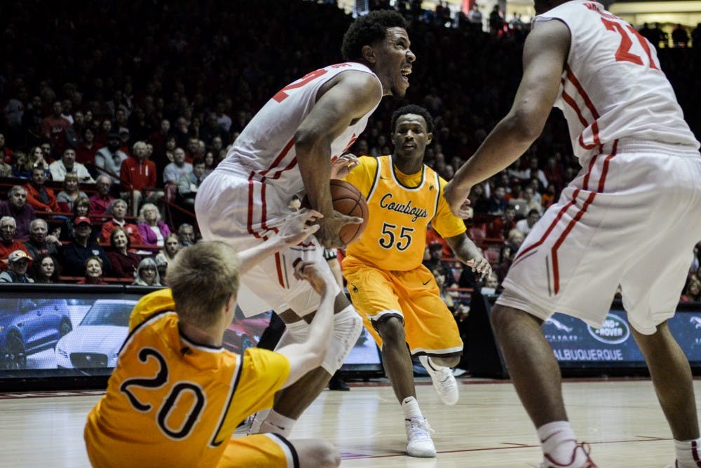 Redshirt junior forward Tim Williams breaks past a Wyoming players hold on his way to the net Saturday, Jan. 16, 205 at WisePies Arena. The Lobos beat San Jose State this past Saturday and will play Air Force this Wednesday at WisePies Arena.&nbsp;