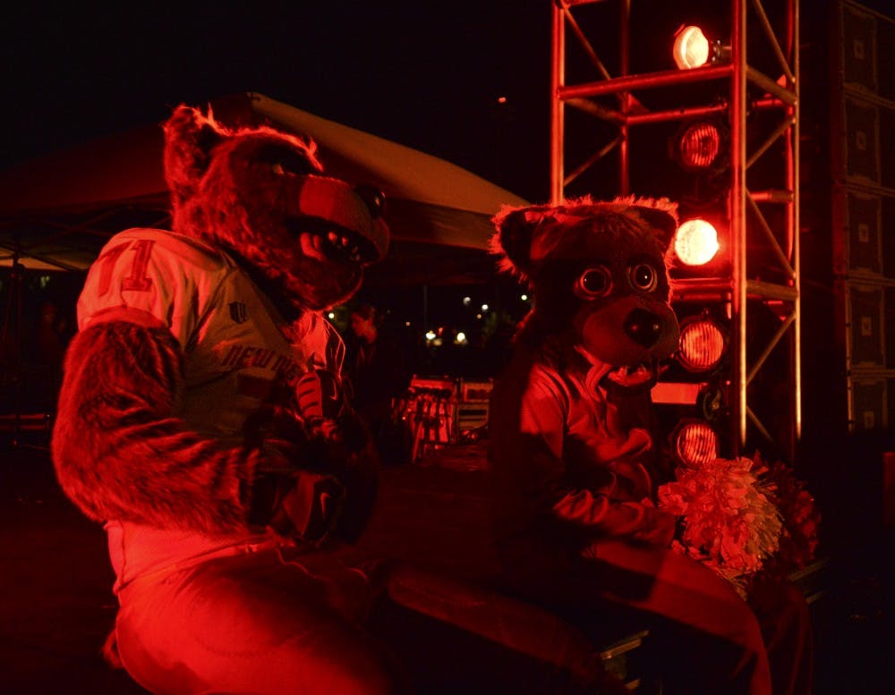 Louie Lobo, left, and Lucy Lobo hang out during the annual Red Rally held at Johnson Field on Sept. 18. Red Rally draws hundreds of Lobos to behold the burning of the rival NM State Aggie.