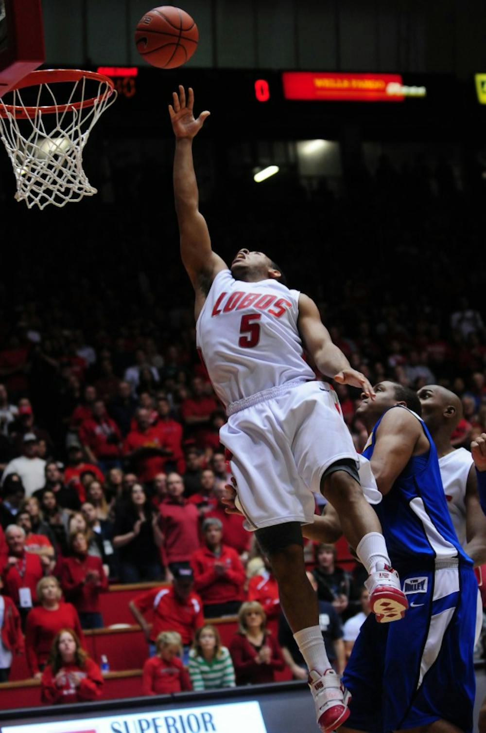 	Lobo guard Dairese Gary shoots a basket during Saturday&#8217;s game against Creighton at The Pit. The Lobos won 66-61, improving to 12-0.