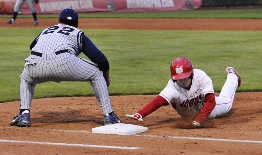 Dane Hamilton slides into third base during the Lobos' 7-5 win over BYU on Thursday. The Lobos are 23-2 on the season, the best start in UNM history.