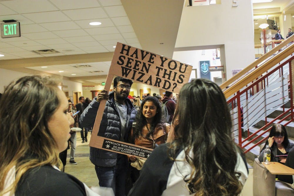 Krithika Saravanan and other students&nbsp;pose for a picture by Harry Potter Day organizers at the SUB on Tuesday, Nov. 22, 2016.&nbsp;