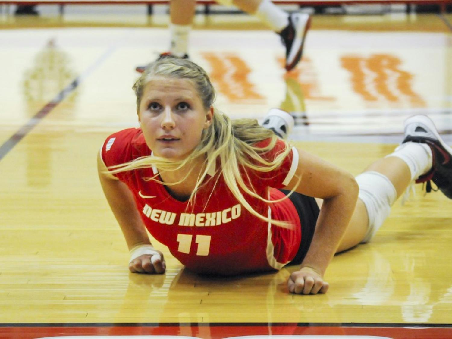 	Lobo sophomore setter Lise Rugland watches the ball go into the audience during the Lobo Alumnae Volleyball exhibition at Johnson Gym on Saturday night. The current Lobos defeated the Alumnae team 3-1.