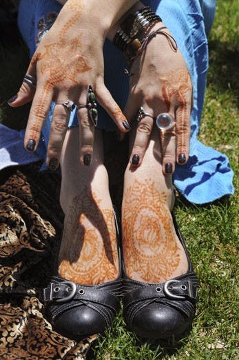 Kayla Mansfield displays her henna tattoos. 