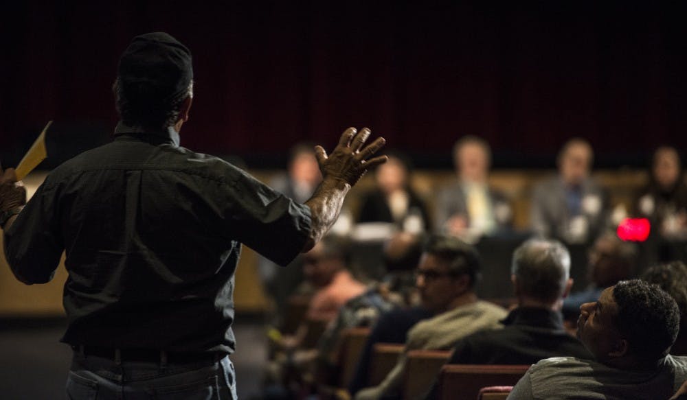 Jerry Trujillo addresses a panel of representatives from the newly proposed Albuquerque Rapid Transit system project about infrastructure flaws and other concerns. A public forum was held at the Kiva Auditorium that consisted of proponents and critics of the new system.&nbsp;