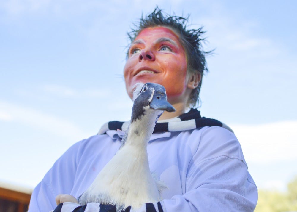 Marina Resh holds a duck near a farm house during the Haunted Barn &amp; Fall Festival fundraiser at Mandy’s Farm in southwest Albuquerque on Oct. 18. Mandy’s Farm provides support to people with disabilities, such as residential, supported employment and day services.