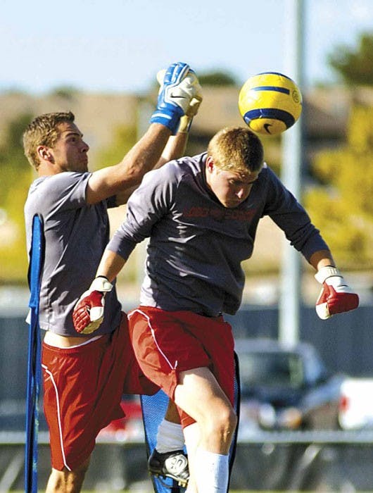 Lobo goalkeeper Mike Graczyk, left, and Justin Fite run goalie drills during practice Wednesday at Robertson Field.