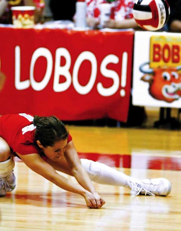 Gayle Tripp digs the ball during Saturday's 3-1 loss against UNLV at Johnson Gym. Tripp recorded her 1,000th dig during the game.