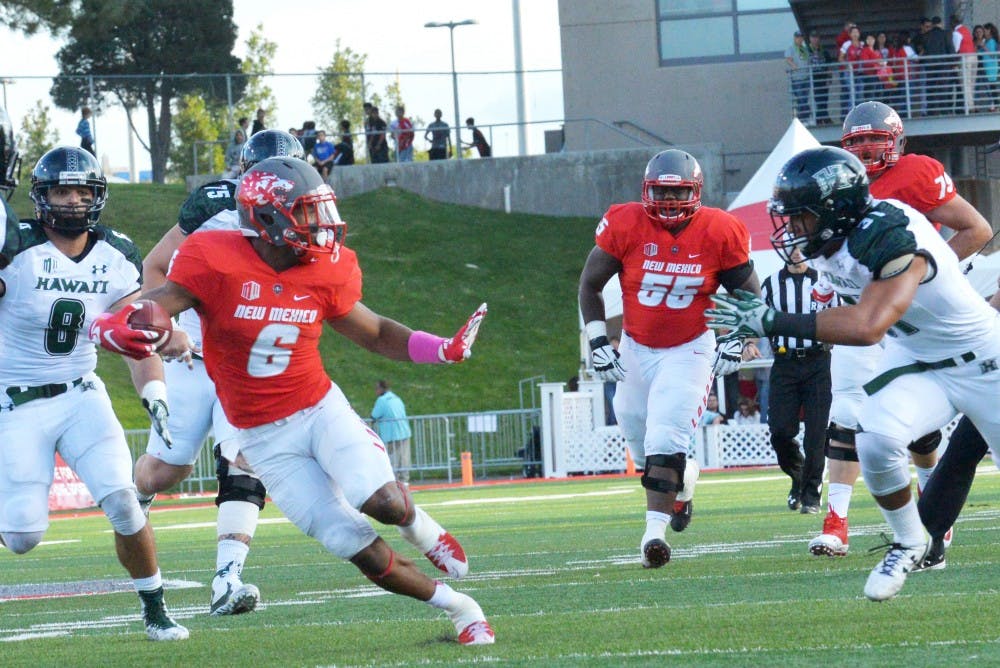 Redshirt senior running back Jhurell Pressley runs through Hawaii’s defense at University Stadium on Saturday, Oct. 17. The Lobos lost to San Jose State 21-31 on Saturday, Oct. 25. 