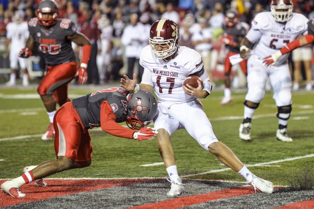 Redshirt senior safety Ryan Santos brings down a New Mexico State player October 3, 2015 at University Stadium. The Rio Grande Rivalry is the annual marque football game between UNM and NMSU.