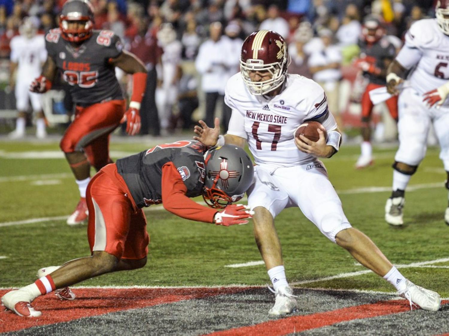 Redshirt senior safety Ryan Santos brings down a New Mexico State player October 3, 2015 at University Stadium. The Rio Grande Rivalry is the annual marque football game between UNM and NMSU.