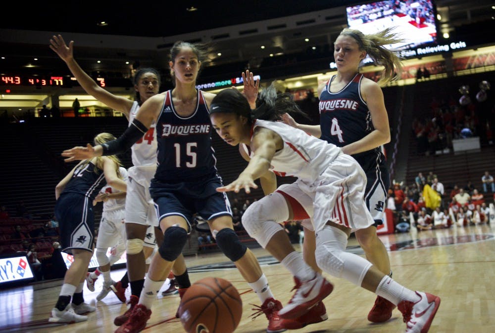 Sophomore guard Kenya Pye loses grasp of the ball as she drives to the net at WisePies Arena Saturday night. The Lobos lost to Duquesne 78-69.