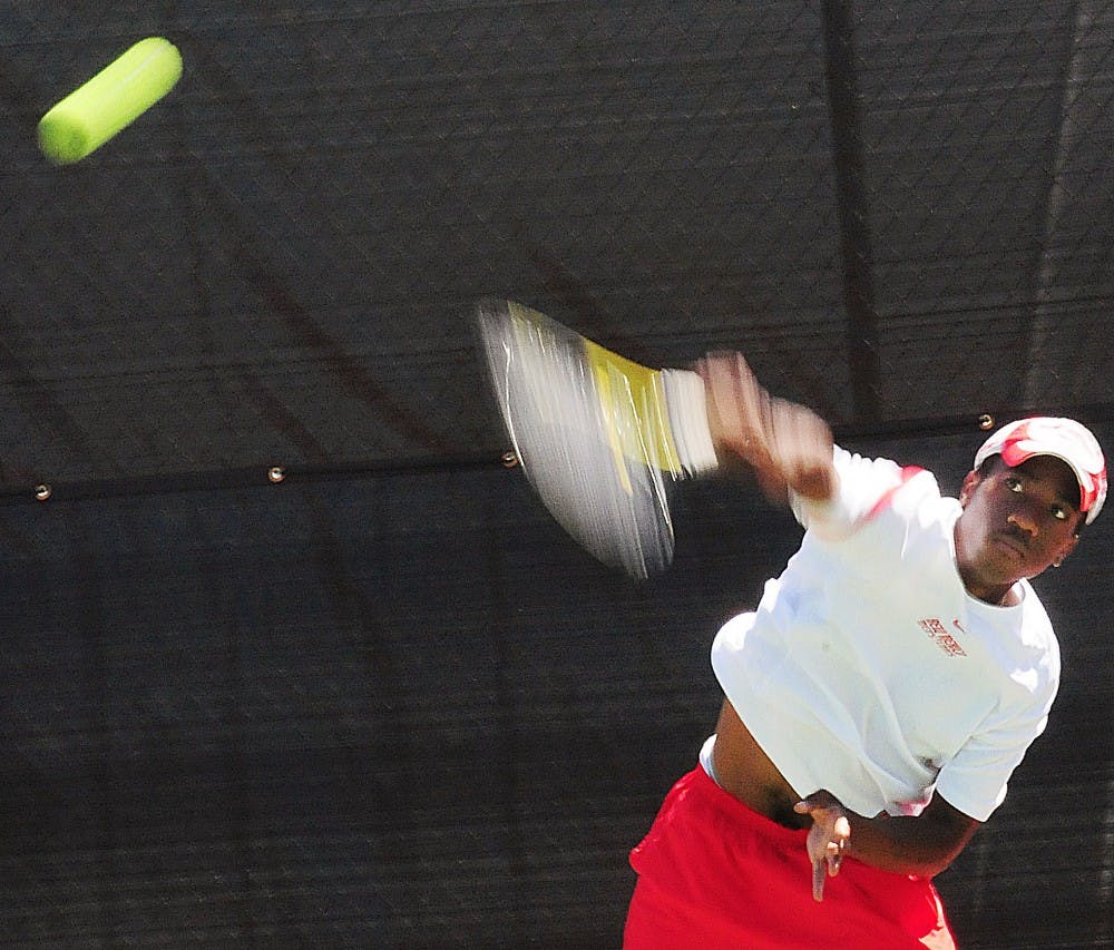 	Jadon Phillips serves to his opponent on Thursday at the Linda Estes Tennis Center. Phillips lost his match. The Lobos lost 4-3 to Boise State.