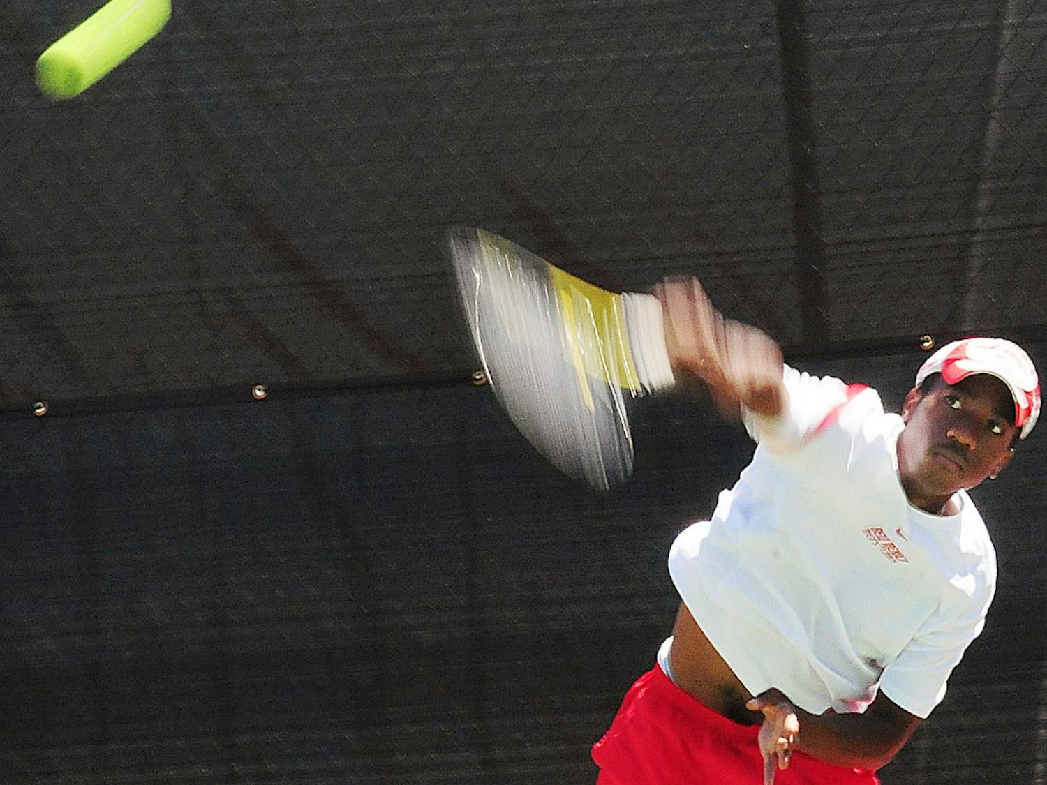 	Jadon Phillips serves to his opponent on Thursday at the Linda Estes Tennis Center. Phillips lost his match. The Lobos lost 4-3 to Boise State.
