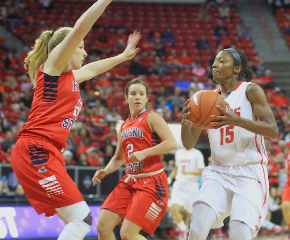 New Mexico's Antiesha Brown works the ball against Fresno State's Alex Furr during the Mountain West Basketball Championship semifinals Wednesday night at the Thomas &amp; Mack Center in Las Vegas.