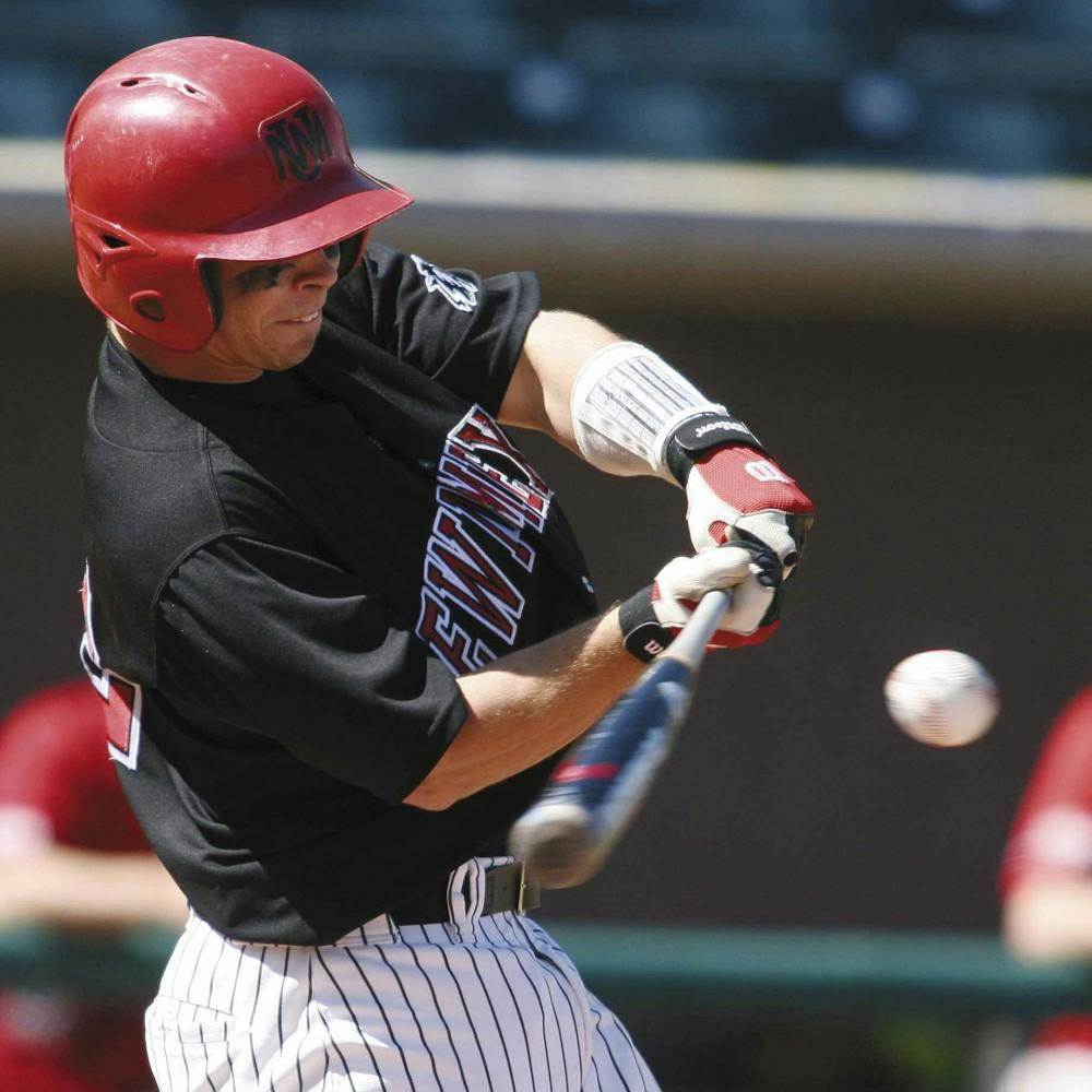 Catcher Drew McDonald swings at a pitch during Sunday's game against Utah at Isotopes Park. The Lobos lost 11-9.