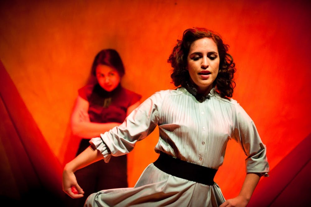 	Amanda Meyers, front, and Amanda Machon prepared during dress rehearsal for the UNM production, “No Exit.” The play opens Friday.. See
page 7 for the full story.