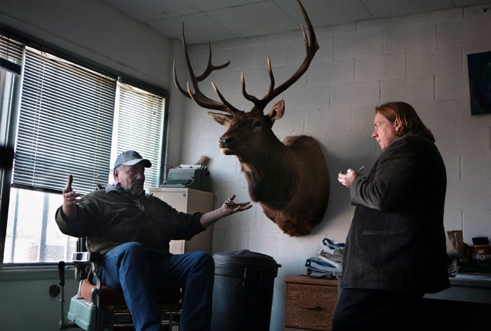 	M.E. Sprengelmeyer, right, publisher and reporter for the Guadalupe County Communicator, interviews Santa Rosa City Councilman Pat Cordova. Sprengelmeyer purchased the Santa Rosa weekly paper last August after the Rocky Mountain News in Denver closed about a year ago.