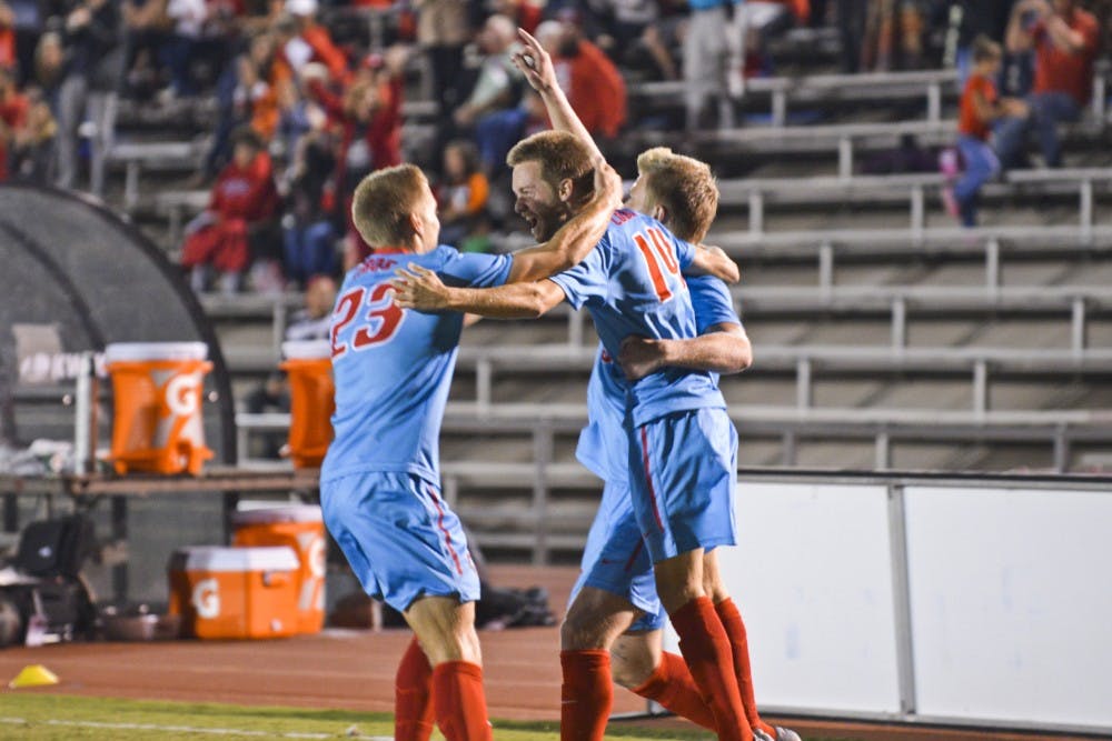 Redshirt midfielder Chris Wehan celebrates with his teammates after he lands the Lobos' first goal against South Carolina Sunday, Oct. 30, 2016 at the UNM Soccer Complex.&nbsp;