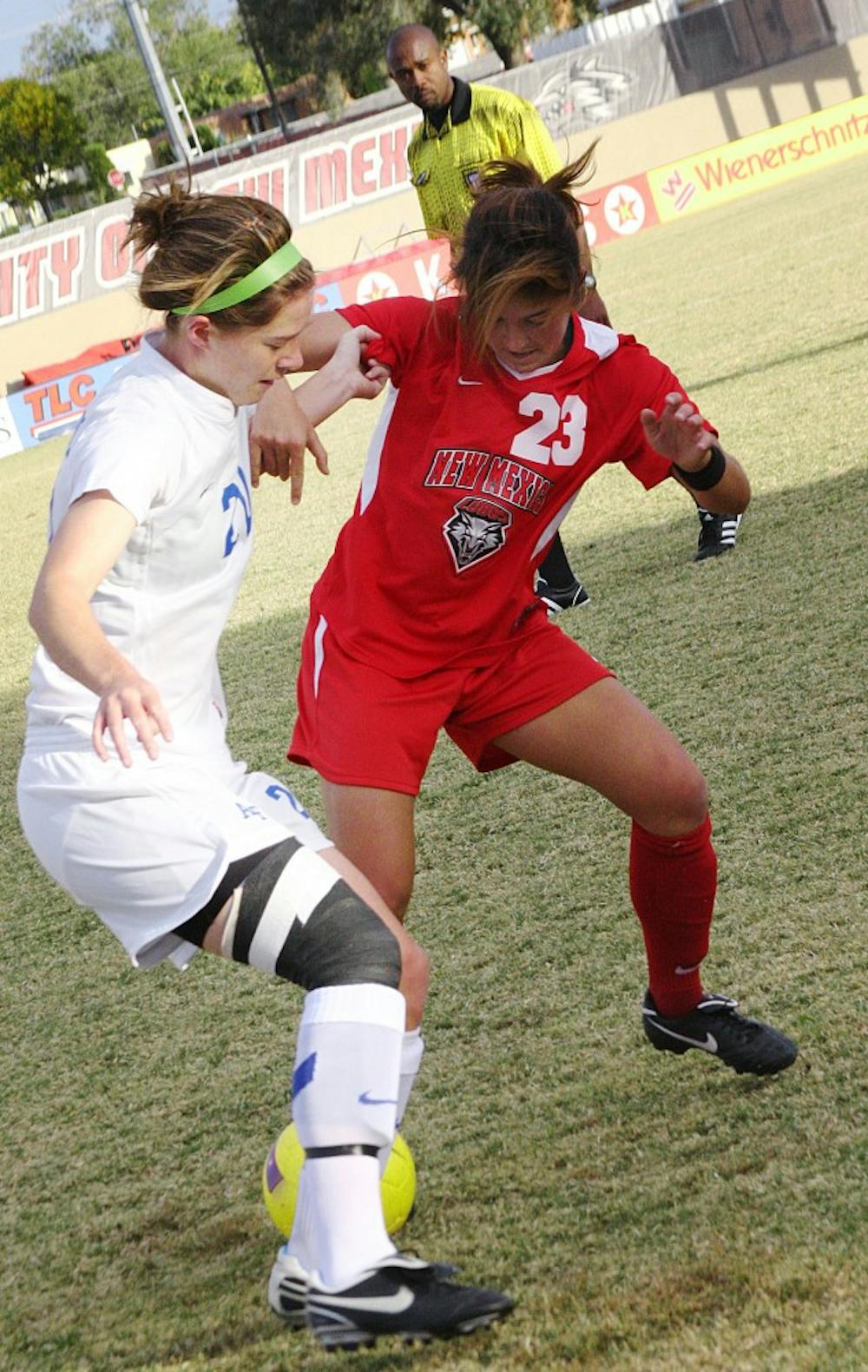	Defender Zaneta Wyne, right, fends off Air Force’s Cassie Wilson. The Lobos blanked the Falcons 1-0 on Saturday at the UNM Soccer Complex to improve to 10-2-2 overall.