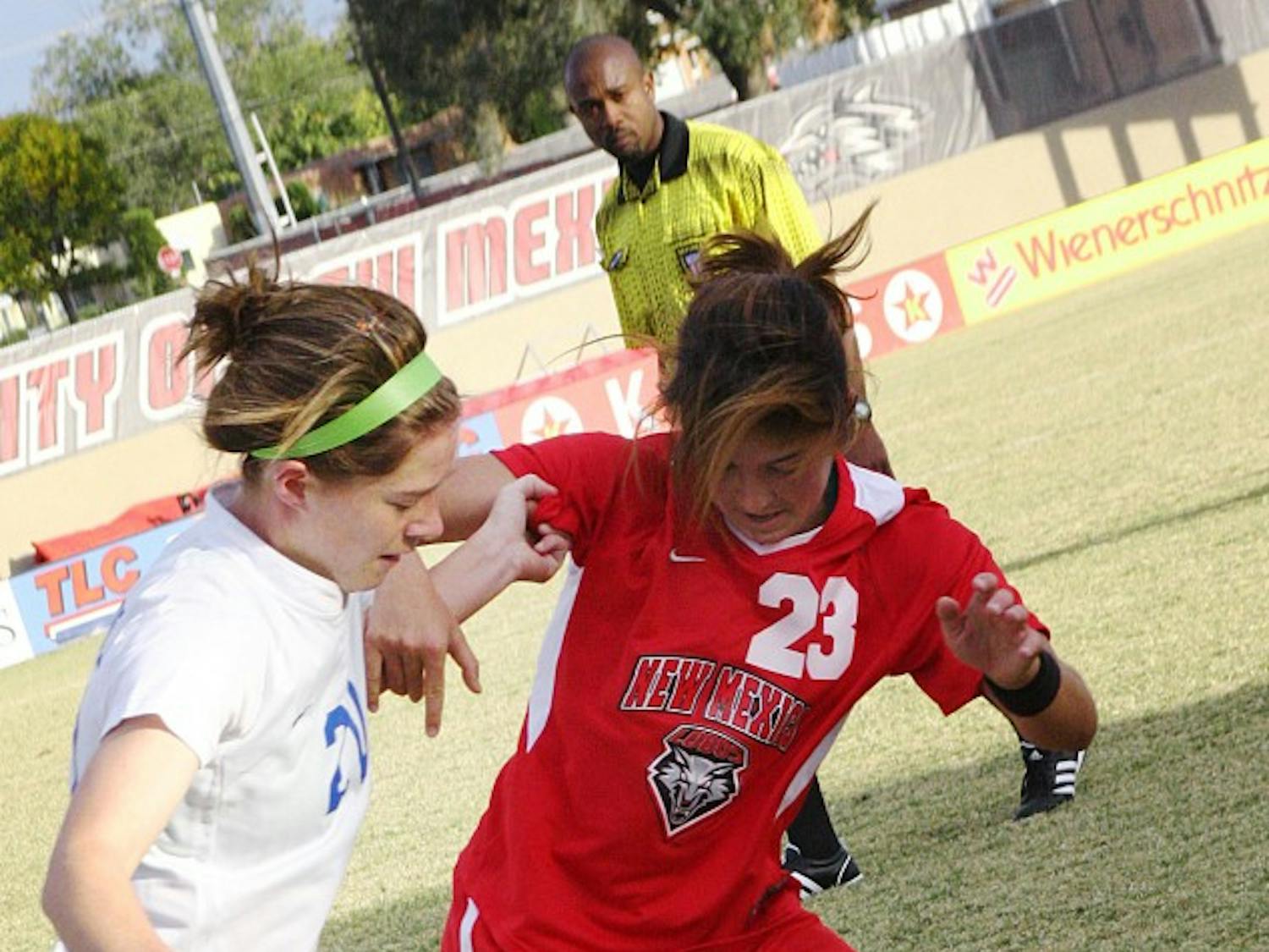	Defender Zaneta Wyne, right, fends off Air Force’s Cassie Wilson. The Lobos blanked the Falcons 1-0 on Saturday at the UNM Soccer Complex to improve to 10-2-2 overall.