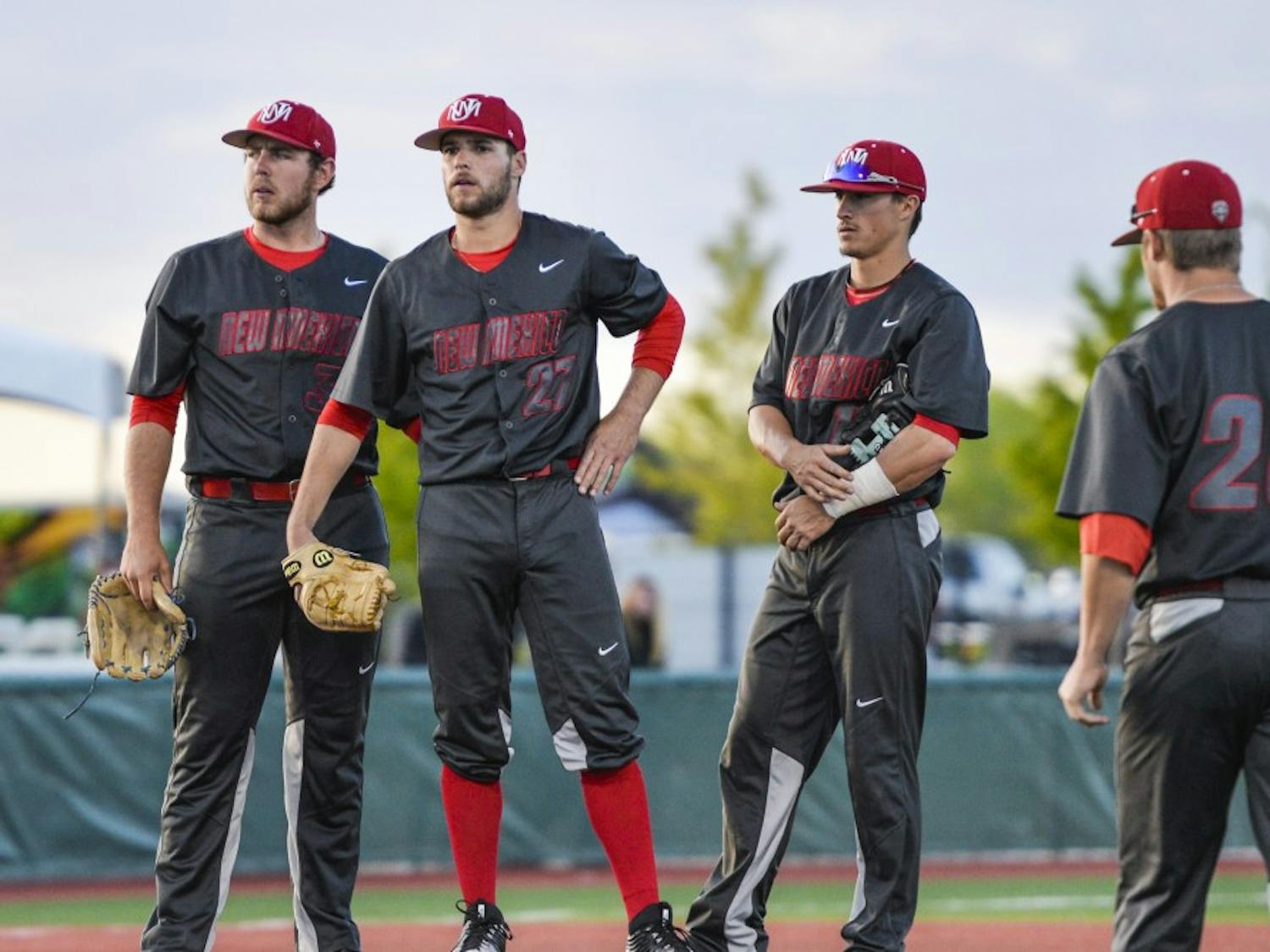 The Lobos meet on the mound during a stop in play while facing off with Texas Tech Tuesday, April. 19, 2016. The Mountain West released a preseason pick that UNM will be the 2017 season champs. 