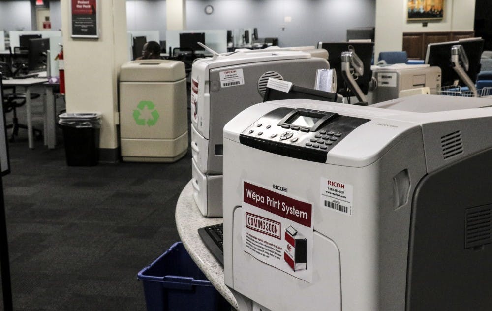 Zimmerman printers display signs about new “Wepo Print System” on June 17,2018.