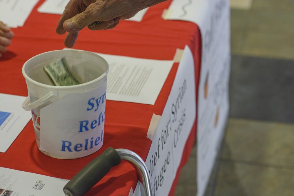 Gernot Bankel, age 73, donates money to ASUMN Community Experience's Syrian Refugee Relief Fund on Thursday, September 24th. Bankel, who moved to the U.S. in 1952 after World War 2 identifies with the current situation in Syria. 