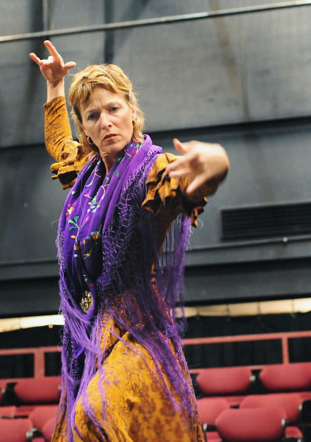 	Susannah Calzada-Garrett performs an improvised dance while reciting a poem by Ángel González during a rehearsal for “Para que yo me llame Ángel González” at the National Hispanic Cultural Center on Sunday. 