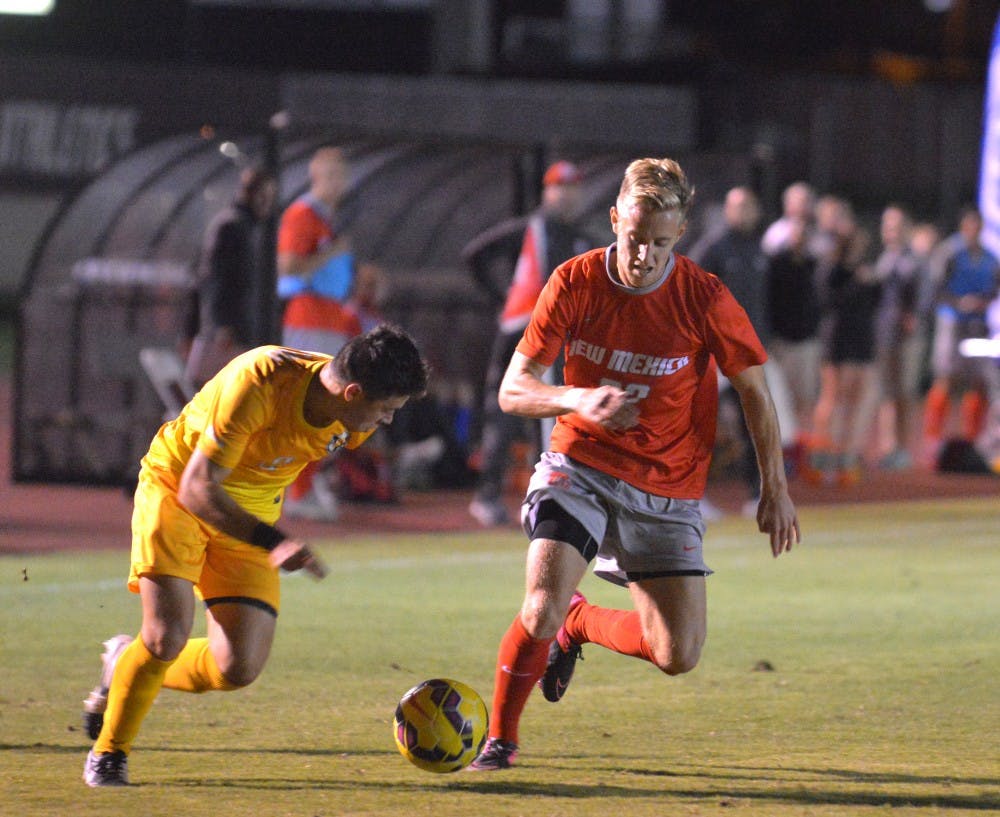 UNM forward Sam Gleadle steals the ball away from Valparaiso yesterday night at the UNM Soccer Complex. The Lobos and the Crusader tied 1-1.