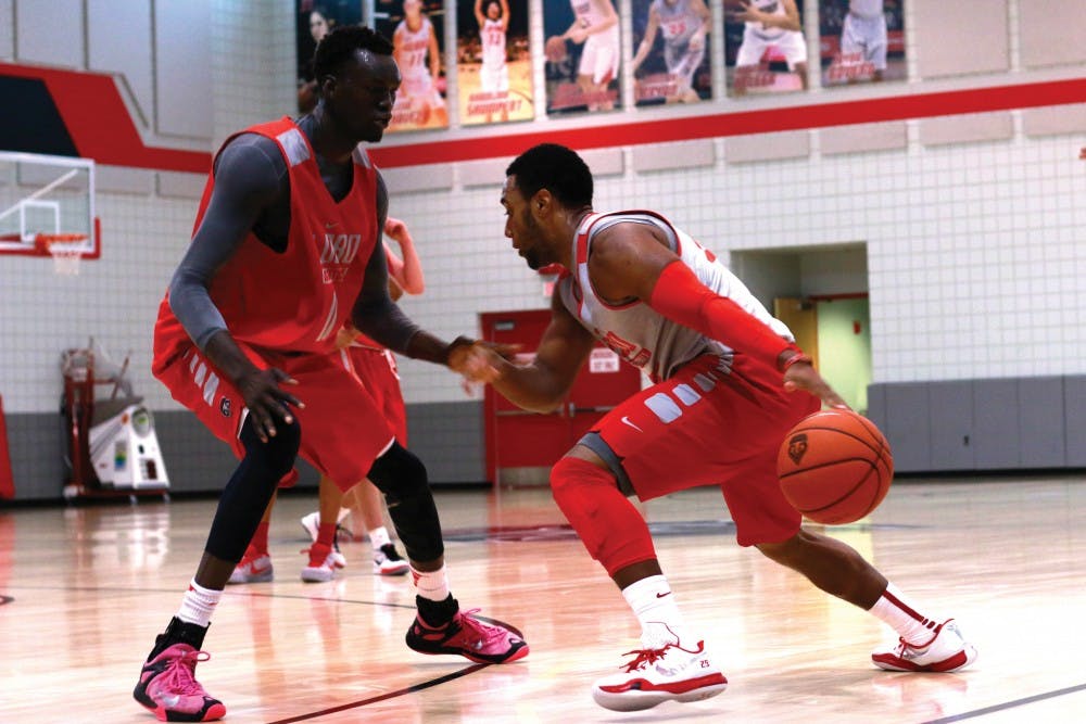 Tim Jacobs #25 dribbles against Obij Ager #11, during the Lobo's first practice of the season on Friday Oct. 2, 2015. The Lobos have their first game Nov. 13 at WisePies Arena against TSU. 