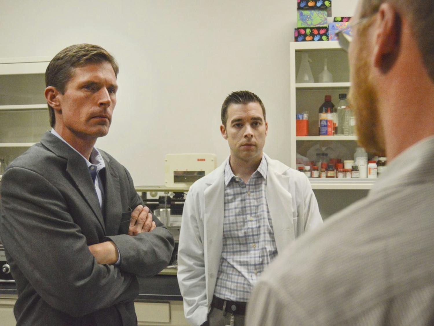 U.S. Sen. Martin Heinrich, left, speaks with Assistant Professors Jonathan Brigman, center, and Jason Weick, right, about an apparatus called a catwalk used to measure gait in animals, in a lab at the Biomedical Research and Integrative NeuroImaging Center at north campus on Monday afternoon. Heinrich came to UNM to discuss health initiatives with members of the Brain and Behavioral Health Institute.