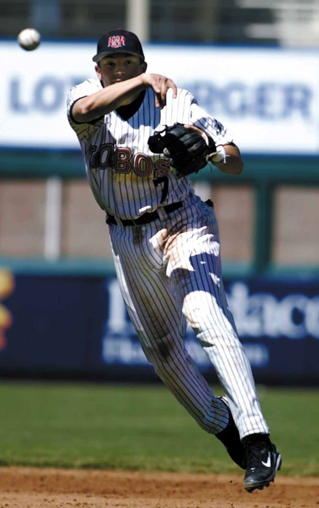 Infielder Scott Gracey throws to home plate during Sunday's 11-6 loss to San Diego State at Isotopes Park.