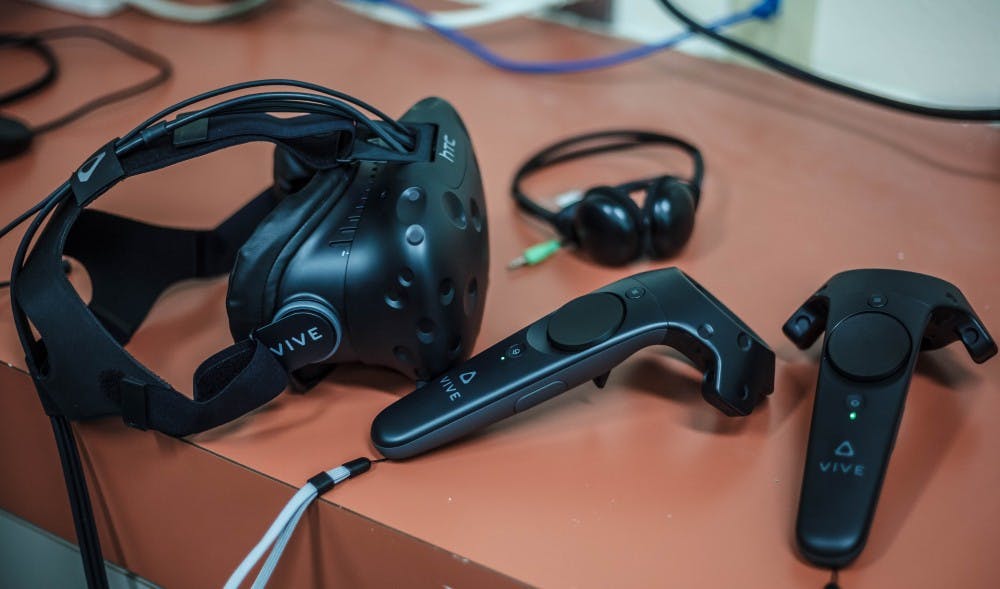 The HTC - Vive virtual reality set consists of a headset, two wireless controllers, and headphones. The virtual reality set is available for use to all UNM students.
