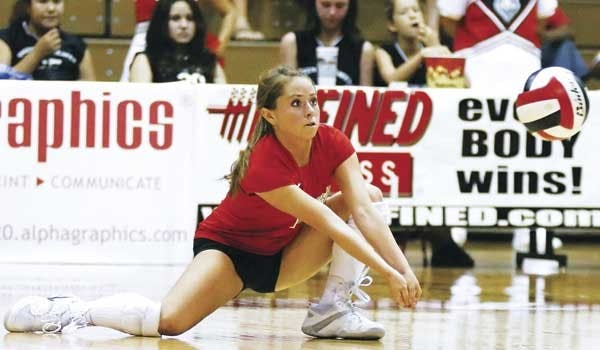 Gayle Tripp saves the ball during Friday's 3-0 win against Wyoming at Johnson Gym. 