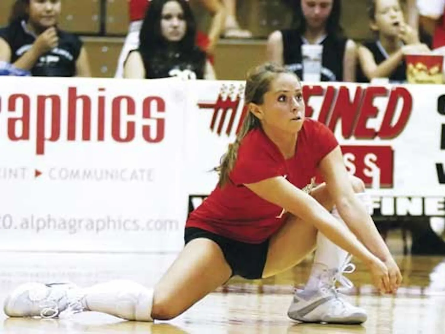 Gayle Tripp saves the ball during Friday's 3-0 win against Wyoming at Johnson Gym.