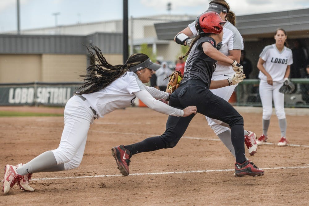 Junior infielder Michala Erickson tags out a San Diego State player Sunday afternoon at the Lobo Softball Fields. The Lobos beat the Aztecs 3-2.&nbsp;