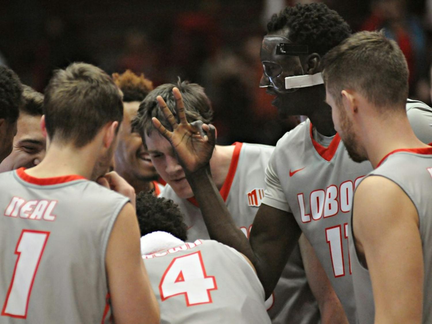 New Mexico center Obij Aget (11) gestures the number three to his teammates after the Lobos captured their third win of the season Wednesday night at WisePies Arena. UNM travels to Los Angeles for a road game at Southern California.