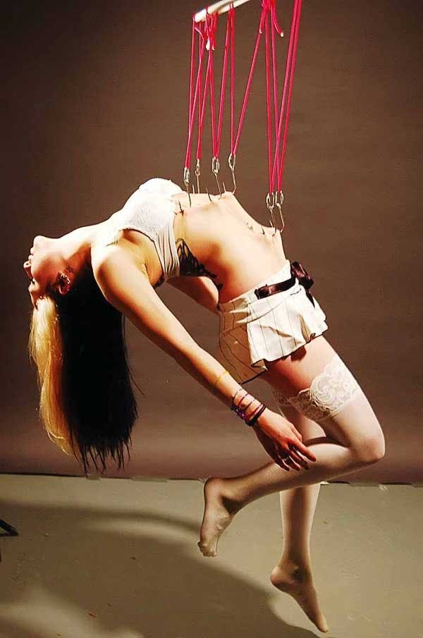 Kasja McCarthy is hung in the resurrection position.