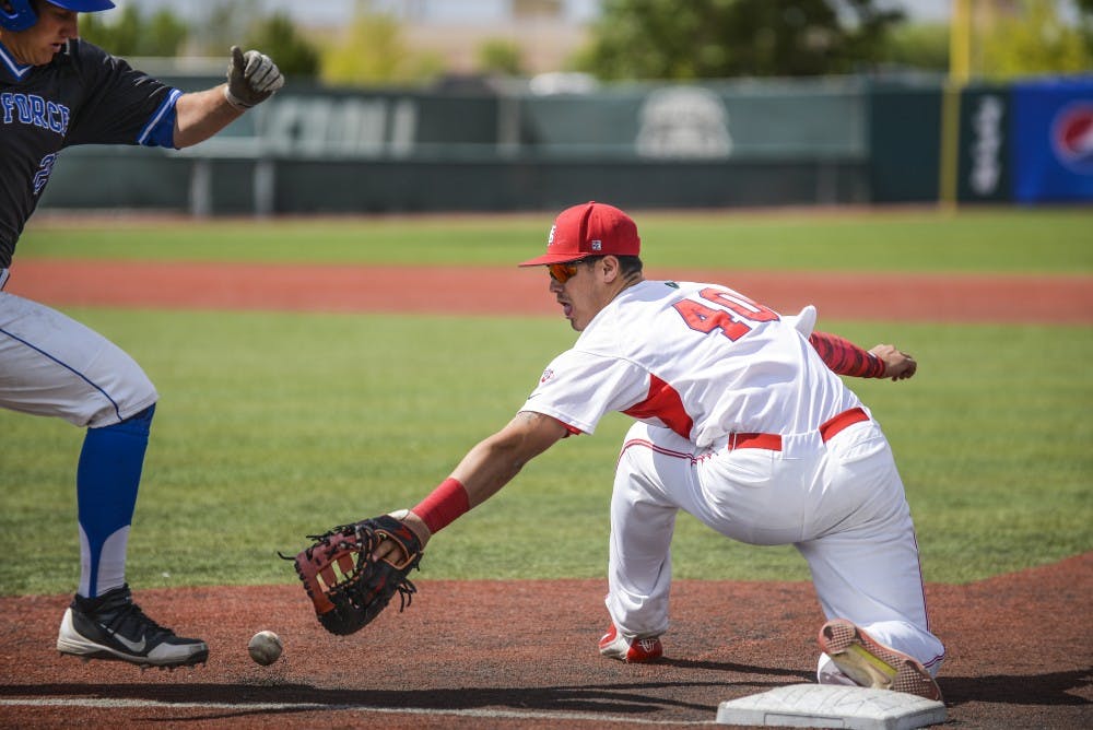 Sophomore first baseman Aaron Arruda fails to catch the ball as a Air Force player sprints to first base Thursday afternoon at the Santa Ana Star Field. 